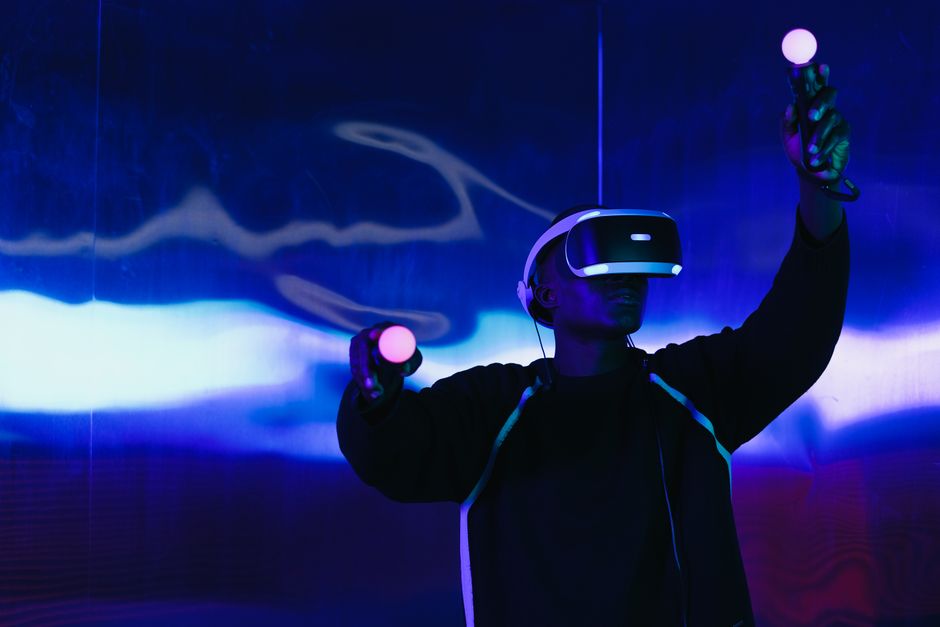 Man exploring a virtual world with a VR headset in a futuristic setting.